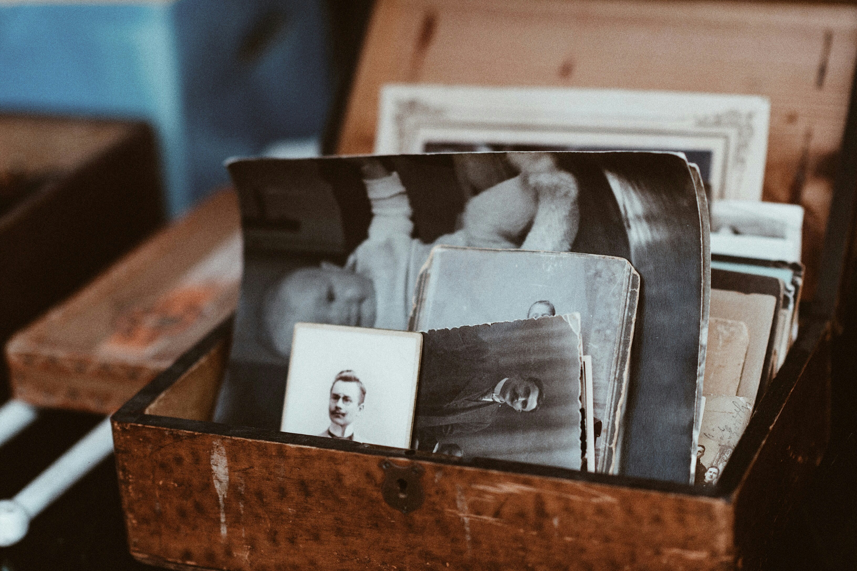 Vintage photographs in a weathered wooden box
